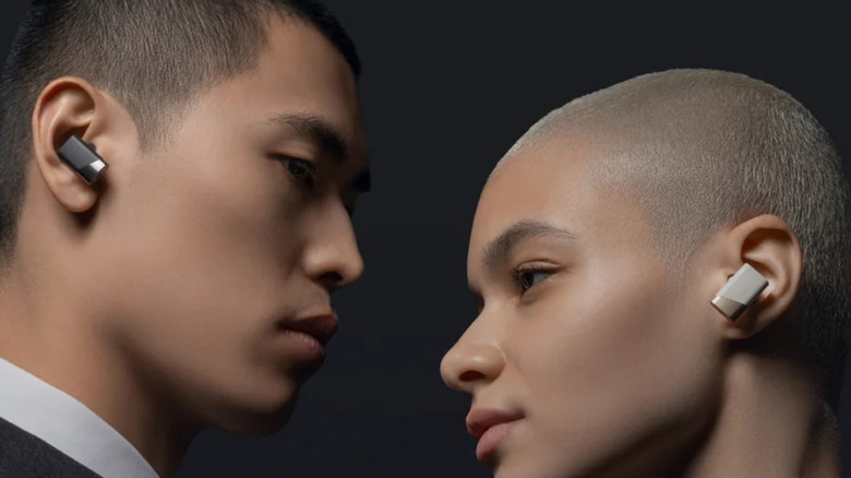 A man and woman wearing Status Pro X
