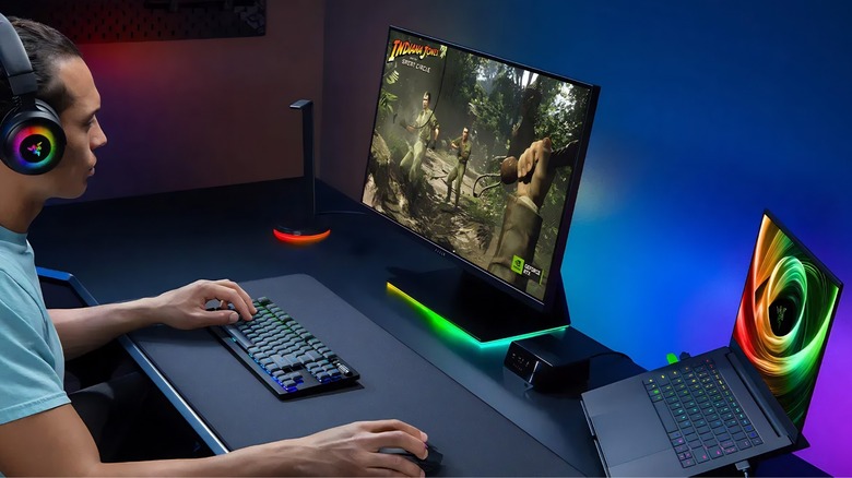 Razer Blade being used in a desktop keyboard and mouse setup to play Indiana Jones and the Great Circles.
