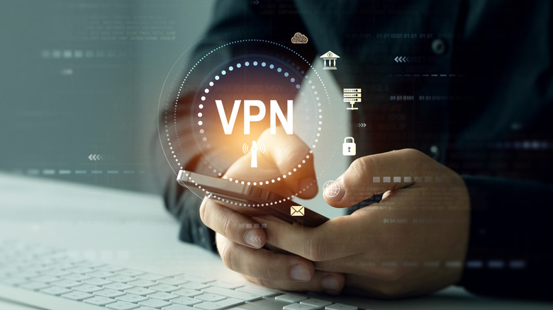person holding a smartphone with a glowing VPN graphics over it highlighting security