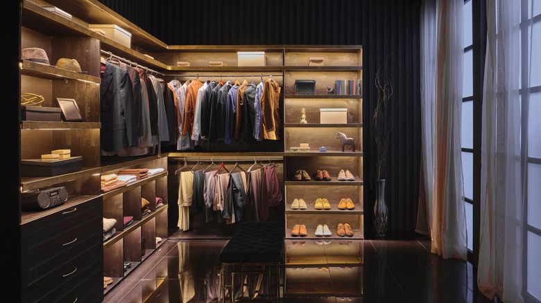 Men's wardrobe in a modern bedroom.