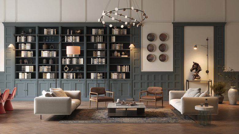 A living room with a large built-in bookcase showing off interior design aesthetics.