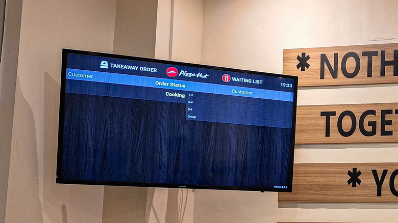 tv used for digital signage in a pizza hut outlet