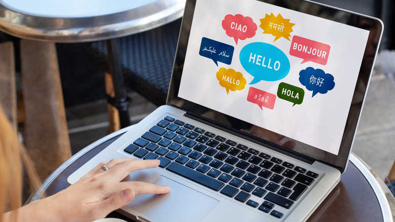 Person at laptop learning various languages
