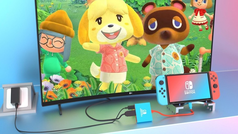 A Nintendo Switch connected to a TV via a portable adapter.