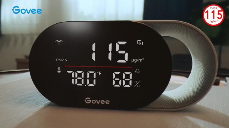 Govee Smart Air Quality Monitor on table reading dangerous levels of PM2.5