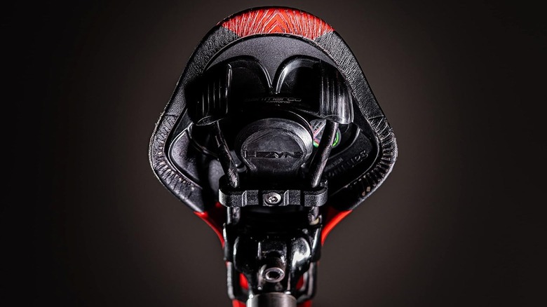 Close-up of a the LEZYNE Saddle Tagger Airtag Case mounted under a bike seat