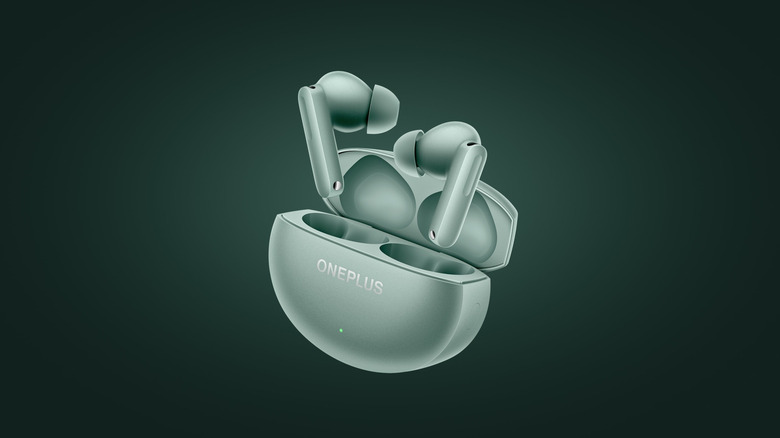 The OnePlus Buds 4 against a green background