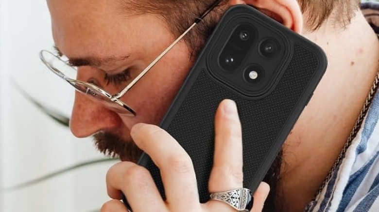 Close-up of a person talking on a OnePlus 15 with Tudia Mergegrip