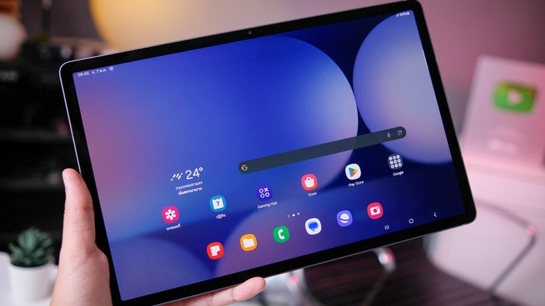 Samsung Galaxy Tab S10+ held in hand in landscape orientation.
