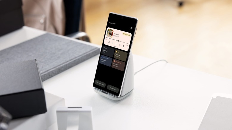 Google Pixel Stand (2nd Gen) on a work desk with a Pixel phone