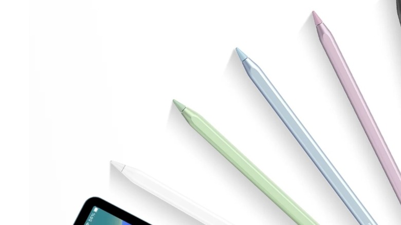 Five iPad pencils in different colors fanned out on a white background with an iPad in the corner