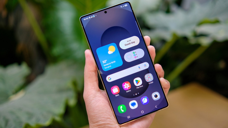 Hand holding a Samsung Galaxy phone