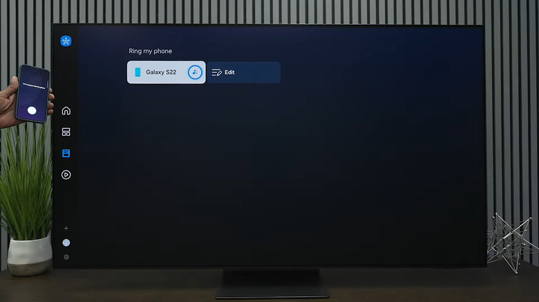 Samsung TV showing Ring my phone feature with phone next to it