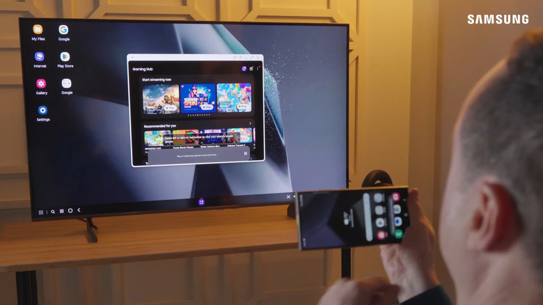 Man using Samsung DeX on Samsung TV with Samsung phone