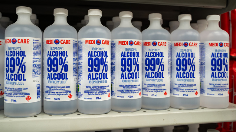 Bottles of 99% isopropyl alcohol on a store shelf.