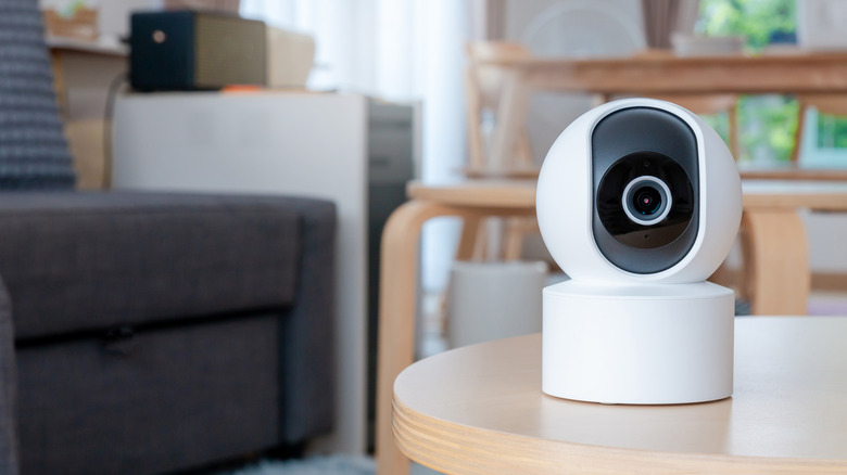 A security camera on a living room table.