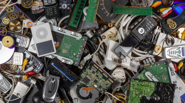 A number of new and old and outdated gadgets piled up