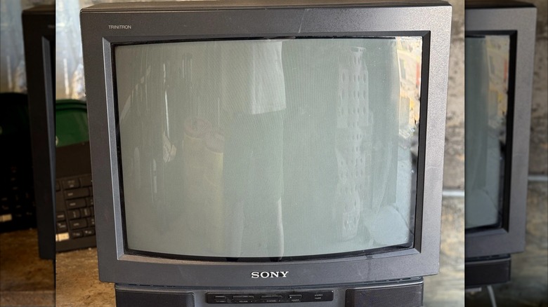 A vintage Sony PVM monitor showing a video game on the color screen