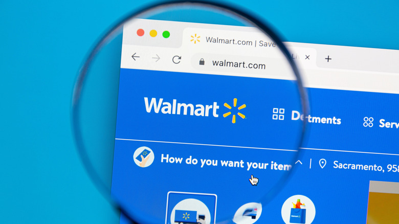 The Walmart website viewed through a magnifying glass.