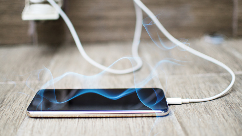 a phone in smokes while charging
