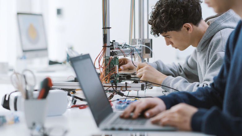 Students using slicing software then 3D printing a project.