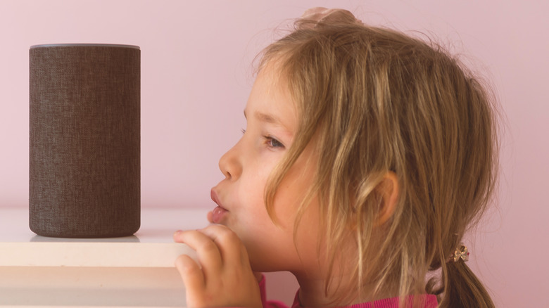 A child trying to hear their speaker