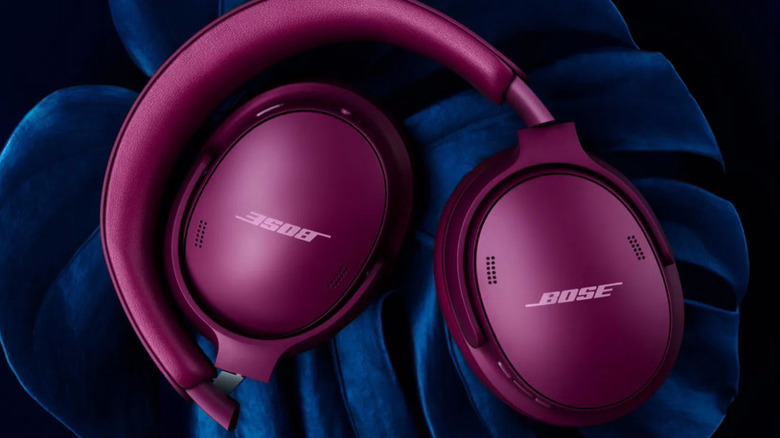 A pair of Rosewood Mauve Bose QuietComfort Headphones on a leaf.