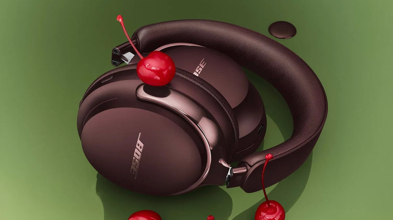 A pair of Cherry Chocolate Bose QuietComfort Ultra Headphones with cherries.
