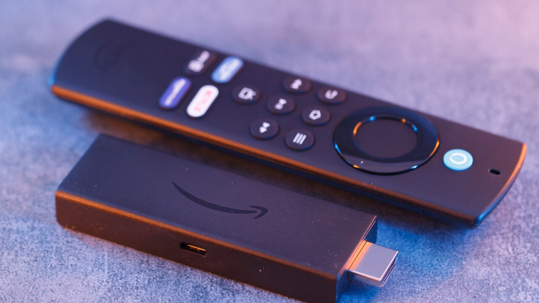 Close up of an Amazon Fire TV Stick and its remote