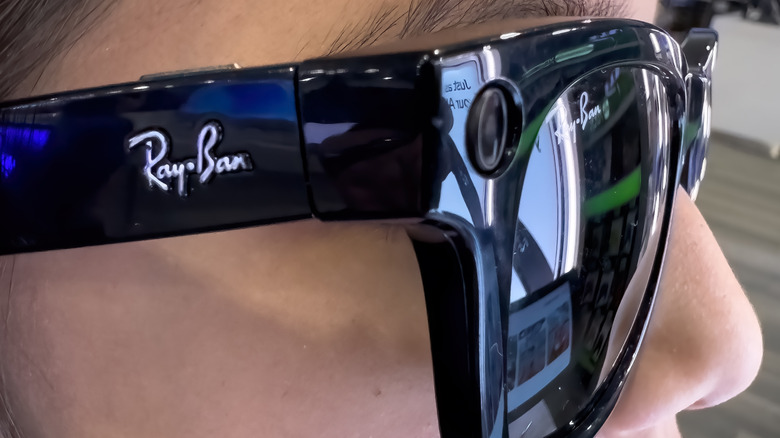A person wearing a pair of Ray-Ban Meta smart glasses.