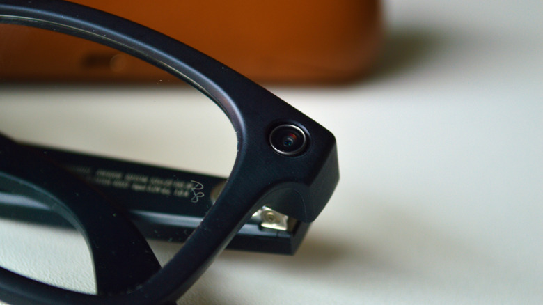 A camera lens on a pair of Ray-Ban Meta smart glasses.