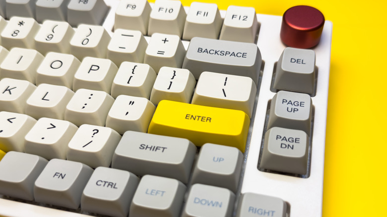 Mechanical keyboard on yellow background