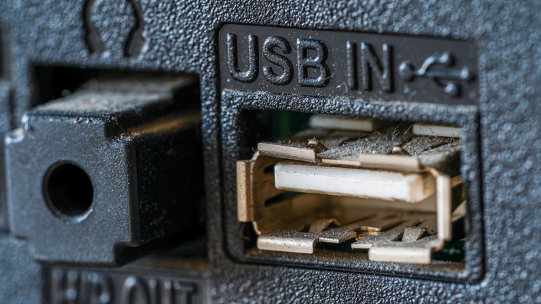 A close-up of a USB port on the back of a TV.