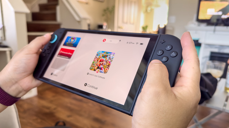 person browsing games holding the Nintendo Switch 2