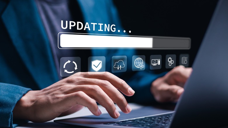 Person performing software update on laptop