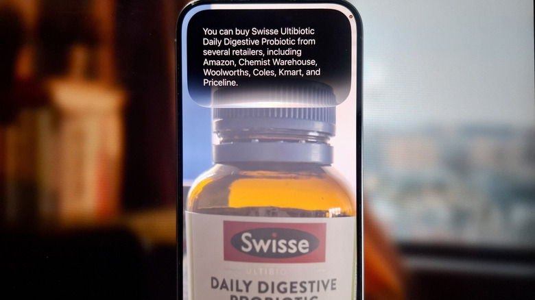 iPhone showing a photo of a supplement with Siri AI identifying shops where you can buy it