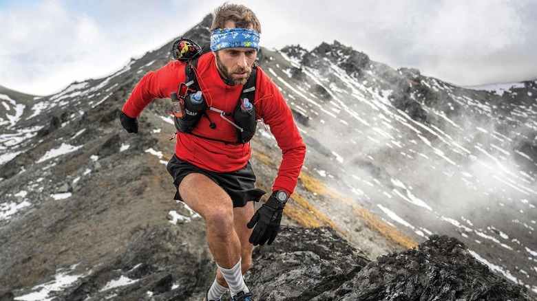 Garmin Endure 3 smartwatch worn by climber on mountain range.