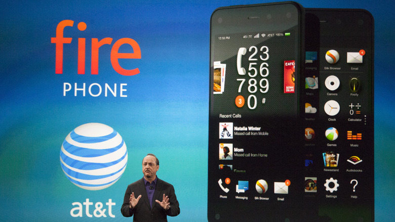 Fore Phone reveal showing phones on screen behind presenter