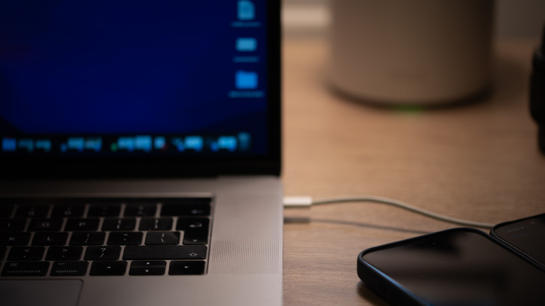 A USB-C cable connected to a MacBook