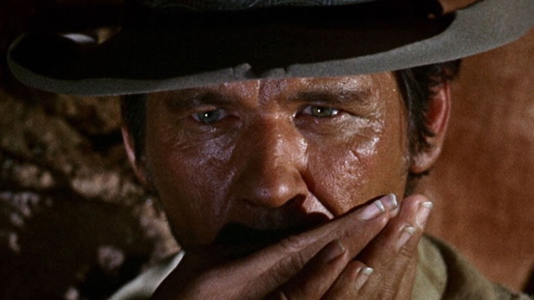 Harmonica (Charles Bronson) playing his harmonica in Once Upon A Time In the West