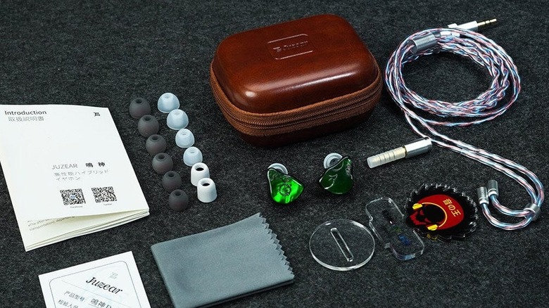 A closeup of the full accessory package for the Juzear Defiant IEM
