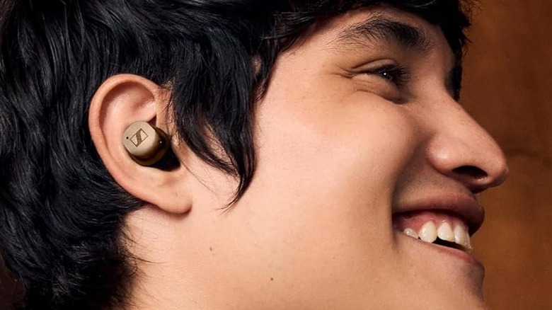 A person wearing the Sennheiser Momentum True Wireless 4.
