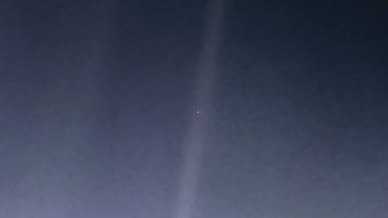 The Pale Blue Dot, an iconic photograph of Earth captured by Voyager 1 spacecraft in 1990.