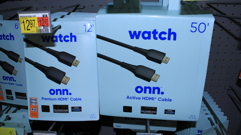 Two boxes of Onn HDMI cables in a store.