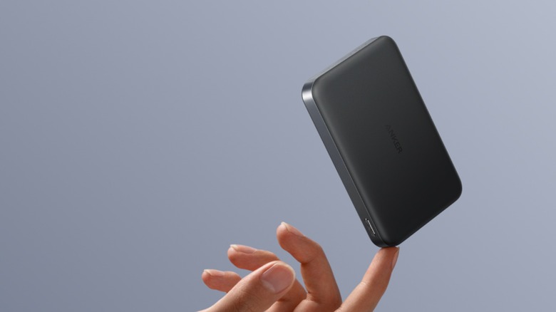 The Anker MagGo power bank balanced on a finger
