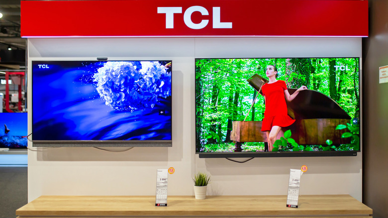 A pair of TCL TVs on display in showroom