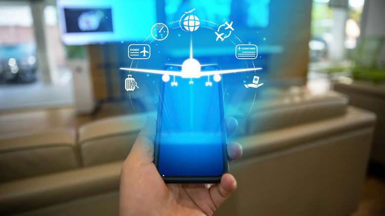 A graphic showing different aspects of air travel on top of a smartphone