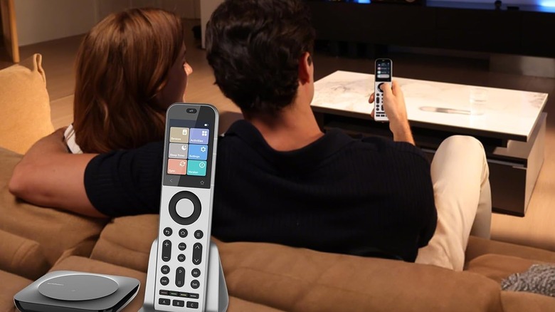 SofaBaton X2 remote with a couple using it to control their television