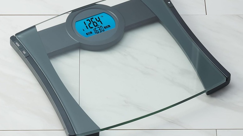 EatSmart Precision CalPal Digital Bathroom Scale on tile floor