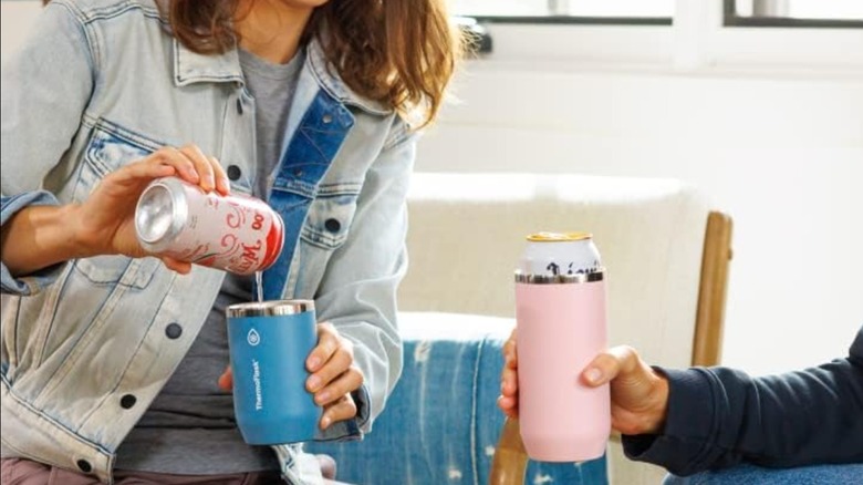 Two women using ThermoFlask Can Cooler to drink